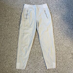 Athleta Womens Trekkie North Jogger Pants Tan Size 4 Tapered Zip Pocket Outdoors